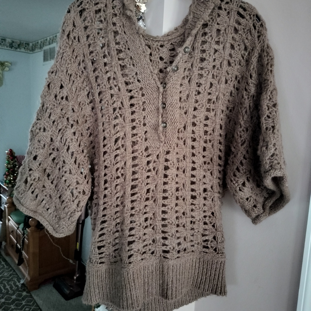 This is a Free People Pointelle Open Knit Alpaca Hooded Sweater in brown. Small